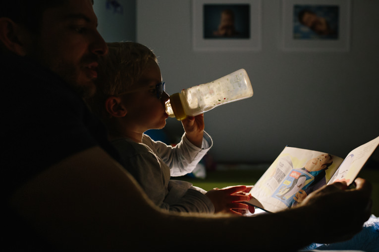 dad and son reading a bedtime story
